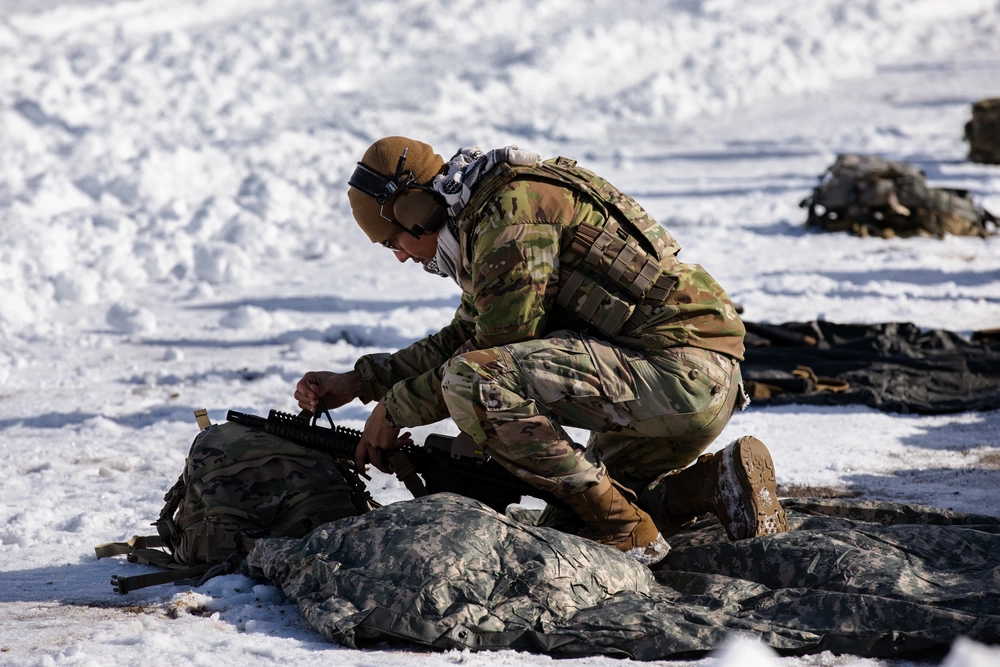19th Special Forces Group service member at a snowy training range near Camp Williams, January 2023